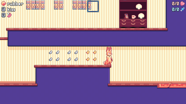 Screenshot of a pixel art platformer, showing the protagonist (an orange fox) standing in a sort of basement of an abstract home, with jelly beans and chick-shaped candies floating next to her and gift boxes and furniture on a level above